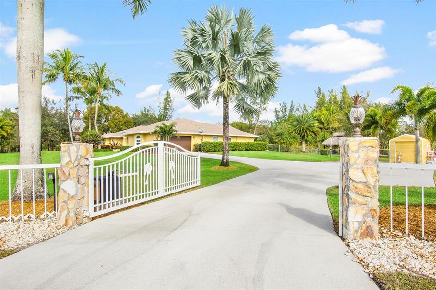 This custom estate home has it all, with 2,307sqft of living. Featuring 4 bedrooms and 3 full baths. Updated kitchen, Bathrooms and floors! Impact windows throughout! Massive storage shed on the west side of the property with a separate gate for entrance. Over 3.5 acres of private land that backs up to Riverbend Park and conservation area. The property is on a paved road in an area of fine homes just west of Jupiter with A rated schools.