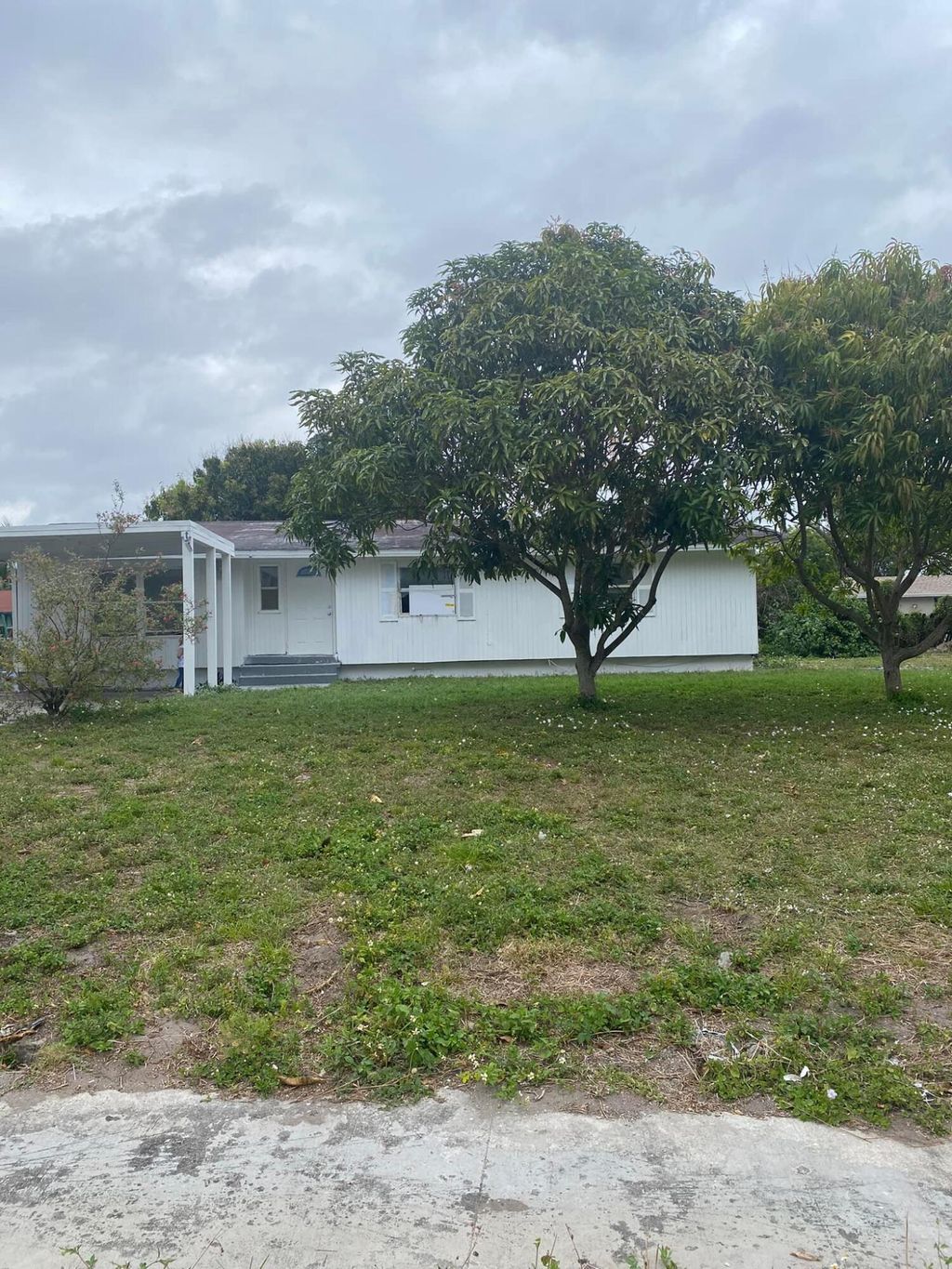Photo of 3811 Chickasha Road Rd, Lake Worth Beach, FL 33462 (MLS # R10784932)