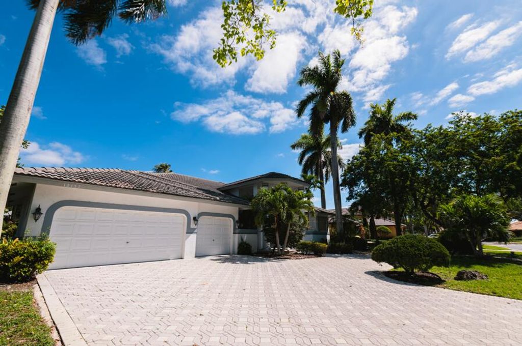 Photo of 12157 NW 9th Drive, Coral Springs, FL 33071 (MLS # B26018977)