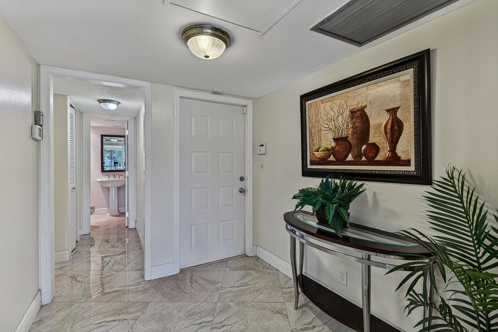 Photo of 4020 W Palm Aire Drive #106, Pompano Beach, FL 33069 (MLS # B26048952)