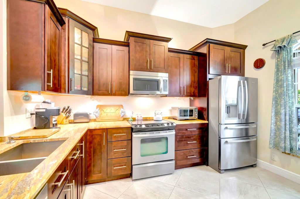 Photo of 1012 Via Jardin, Riviera Beach, FL 33418 (MLS # R11069731)