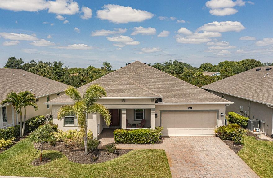 Come see this beautiful Marquesas model located in the most prestigious 55+ community in Vero Beach. This wonderful 3/2 with a large den home features all impact windows, chef's kitchen with a large island, water softener system, great room, extended screened patio with preserve views, wood like plank tile throughout the house, luxurious primary bath, natural gas, extended garage and so much more. Resort style clubhouse features fitness center, pool, pickleball, and game rooms. Low HOA includes all lawn care. This is Florida living at its best.