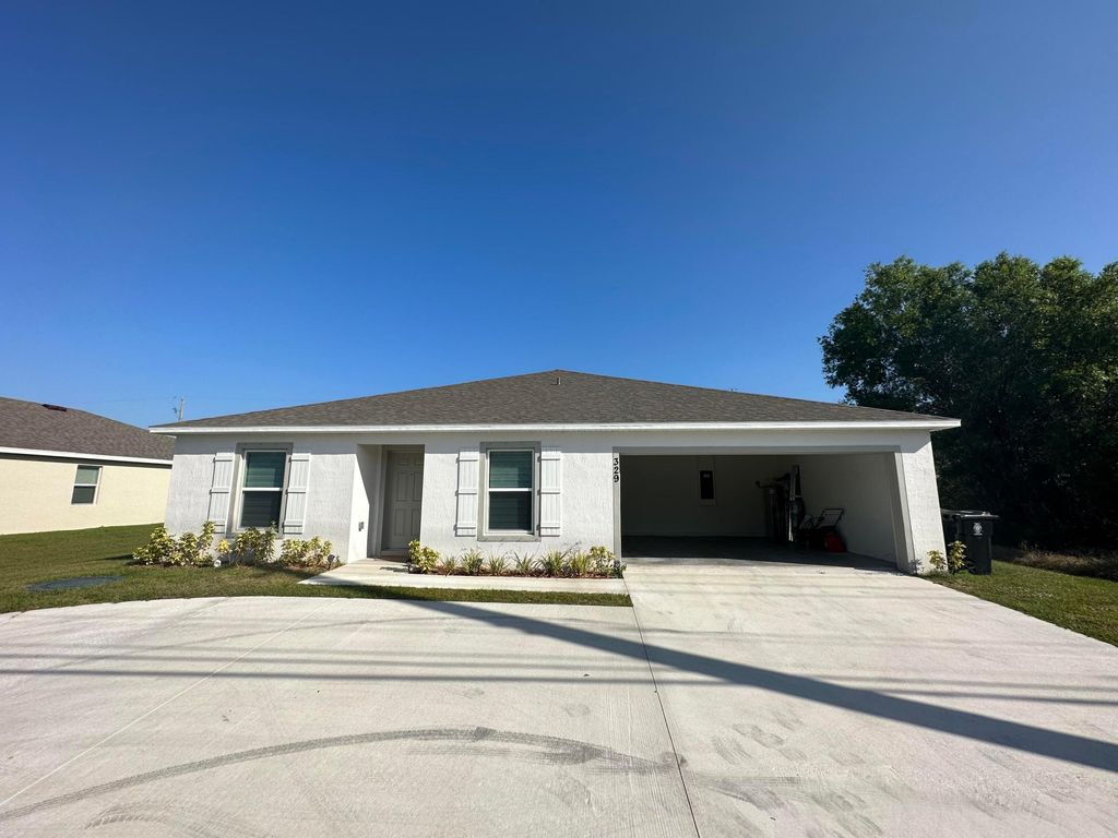 Photo of 329 SW Becker Road, Port Saint Lucie, FL 34953 (MLS # R10931016)