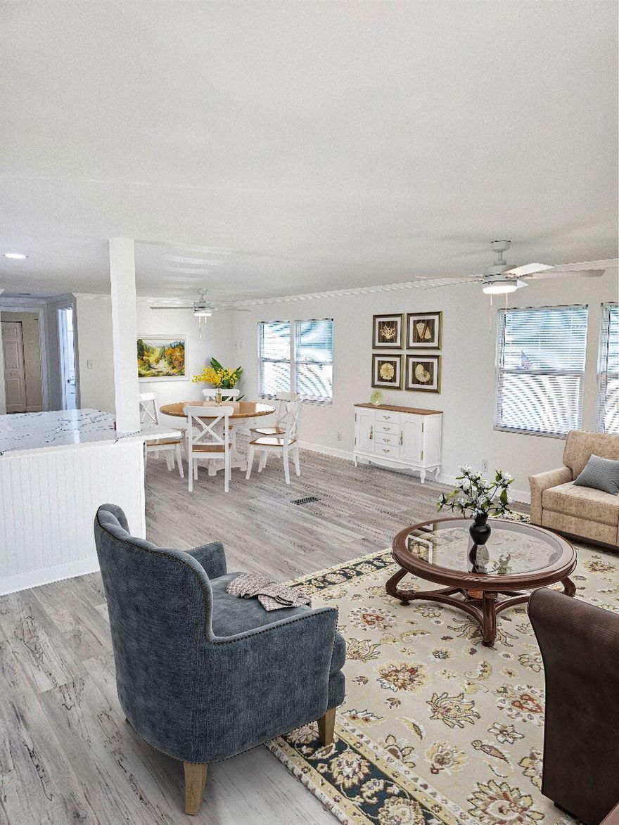 This stunning, fully updated manufactured home in Jensen Beach's desirable Pinelake Village truly checks every box, offering an open, bright, and spacious layout that feels unbelievable from the moment you enter. The 2022 roof provides peace of mind, while the chef's kitchen showcases new shaker cabinetry, granite tops, stainless steel appliances, a center island, and elegant crown molding. Both bathrooms have been completely remodeled with high-end cabinetry, granite tops, and beautifully tiled showers, and luxury vinyl plank flooring runs seamlessly throughout for easy maintenance. With countless upgrades and meticulous attention to detail, this home shows like a model. PLV is an active adult community with fantastic amenities, making this the perfect place to enjoy your new lifestyle!