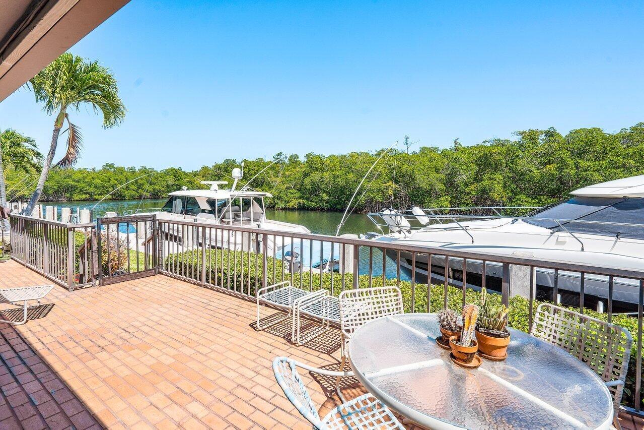 Live An Exceptional Waterfront Lifestyle in this Single-Story, Corner Deepwater Villa located in a Guard-Gated Community In East Boca Raton! This Boca Marina residence is one of the BEST waterfront locations and offers OUTSTANDING Location and Water Views and overlooks a protected preserve for ULTIMATE privacy and relaxation! Features A 60++' Dock for Boating Enthusiasts, 3 Bdrms, 3 Full Baths w/ Luxurious Upgrades including Custom Cabinetry, Granite & Quartzite Counters, a Fully Renovated Master Bath And Dressing Room, PLUS a New Roof & Impact Windows! Experience The Best of Florida Living in Boca Marina, which Boasts an Array of Amenities, including Tennis & Pickleball Courts, a Playground, Clubhouse, Bocce Ball, an Inviting Oversized Pool & Spa, & Access to Select Golf Private Courses!