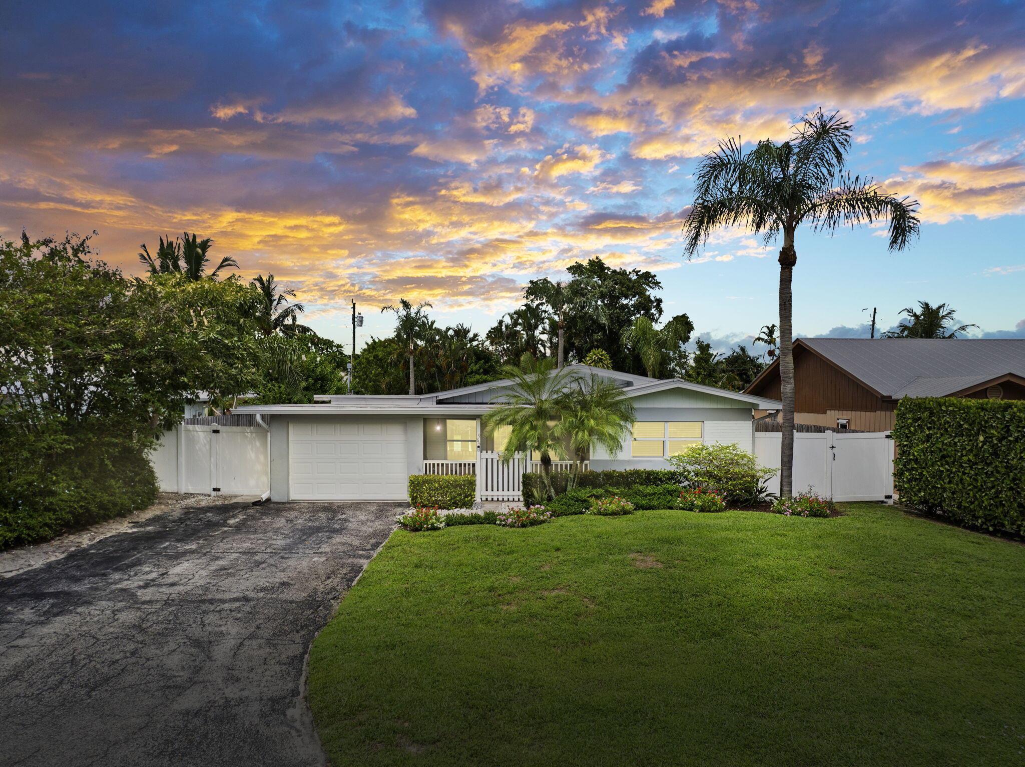 CLASSIC FLORIDA CHARM! You must see this beautifully updated 3BR/2BA CBS POOL home in Palm City. This home features a gorgeous quartz kitchen w/butcher block island and stainless appliances, spacious open living room & family/dining room with lots of natural light! This home has been updated with a metal roof in 2019, new impact windows, doors and garage door. AC replaced in 2022, new electric panel, new expoxy garage floor and there's aq new water heater. You will love the outdoor space that features a sparkling POOL & PATIO with firepit that is perfect for entertaining or bbq's. Large fenced in backyard with shed and plenty of room for your boat or Rv. Very quiet street! TOP PALM CITY LOCATION! Minutes to the boat ramp, beaches, shopping, A+ rated schools and great restaurants!
