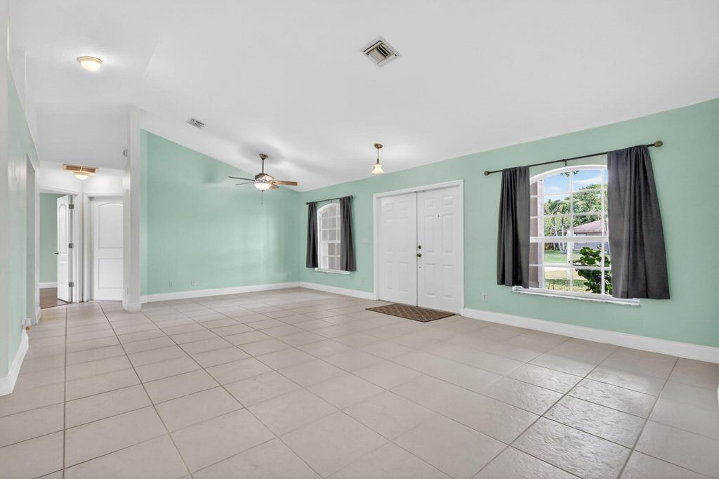 Photo of 780 Orchid Drive, Royal Palm Beach, FL 33411 (MLS # B26020826)