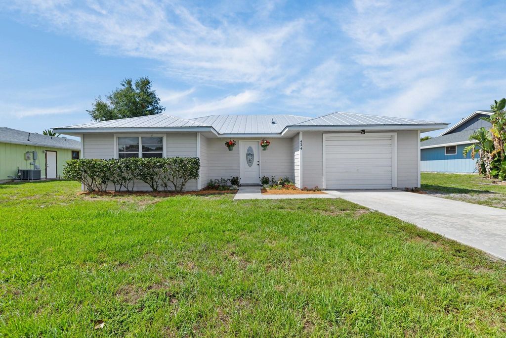 Photo of 434 SE Langfield Avenue, Port Saint Lucie, FL 34984 (MLS # F10506258)