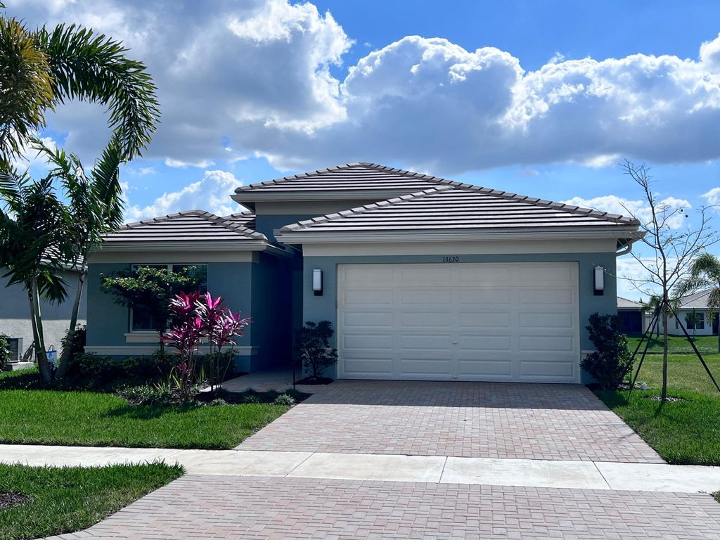 Photo of 13630 SW Oceanus Boulevard, Port Saint Lucie, FL 34987 (MLS # R10960268)