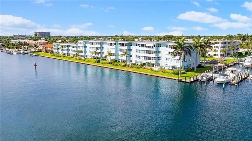 Beautiful 3rd floor unit with direct intracoastal and ocean views from this totally remodeled 1 bedroom, 1 bathroom condo! Nestled in the marina area of Lighthouse Point & home to awesome views of the inlet, Hillsboro Lighthouse & daily intracoastal boat parade, this condo is a winner! Unit 10C features a beautifully renovated kitchen w/ custom cabinets, granite counter & stainless steel appliances, bathroom is updated as well as all the windows are impact rated. Enjoy coastal living in this all ages community that has a pool with community room, Tiki hut for grillin' & chillin', and a private boat dock that may have slips available for rent now! Brand new roof & seller paid assessment! Pick up trucks allowed! Land lease included in the maintenance fee.  Laundry is next door to the unit!