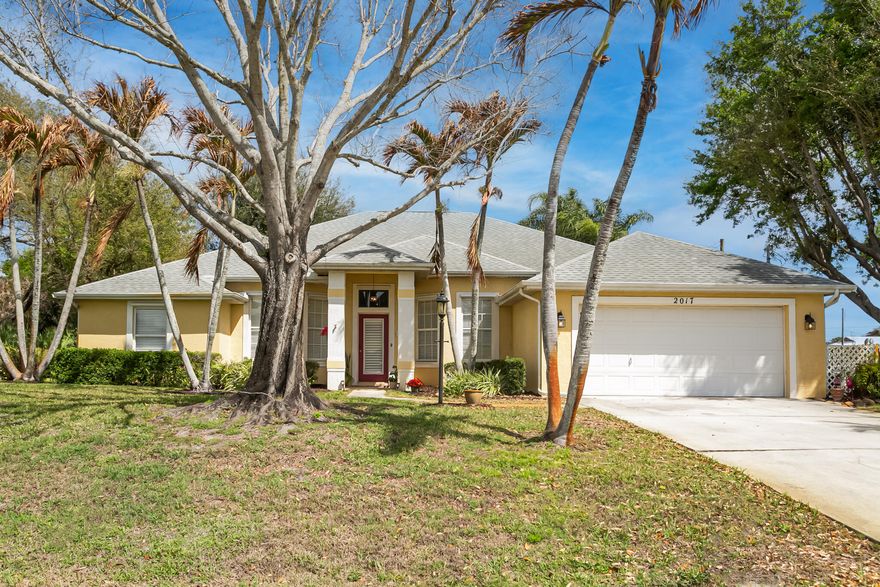 Welcome to Paradise!  Impressive Custom-Built CBS, One Owner, 4 Bedrooms, 3 Full Bathrooms, 2 car Garage on .47 of an Acre of Mature Landscaping with screened in Patio in Sandpiper Bay Community!  Prepare to be Impressed!  Elegant Foyer invites you into the Formal Dining Room, Formal Living Room or spacious Family Room w/ French Doors to Screened Patio.   Tile Flooring throughout main living area.  Spacious Eat-In Kitchen w/ S.S. Appliances, Granite Countertops and Snack Counter. Primary Bedroom, w/ carpeting, features French Doors to Patio w/ spacious Bathroom Suite.  Double Walk-In Closets.  Guest Bedrooms were thoughtfully planned.  2 Bedrooms, w/ carpeting, share a Full Bathroom, the Rear Bedroom, w/ laminate floor, has Full Bathroom w/ access to the Patio Area. *See Broker Remarks.