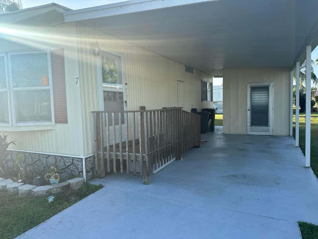 Photo of 7 Tikal Lane, Port Saint Lucie, FL 34952 (MLS # B26063188)