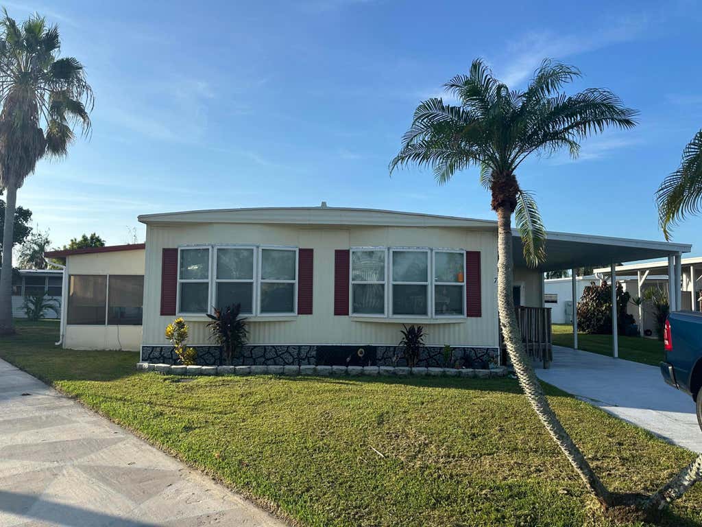 Photo of 7 Tikal Lane, Port Saint Lucie, FL 34952 (MLS # B26063188)