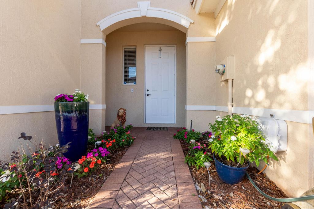 Photo of 6130 Seminole Gardens Circle, Riviera Beach, FL 33418 (MLS # R11066003)