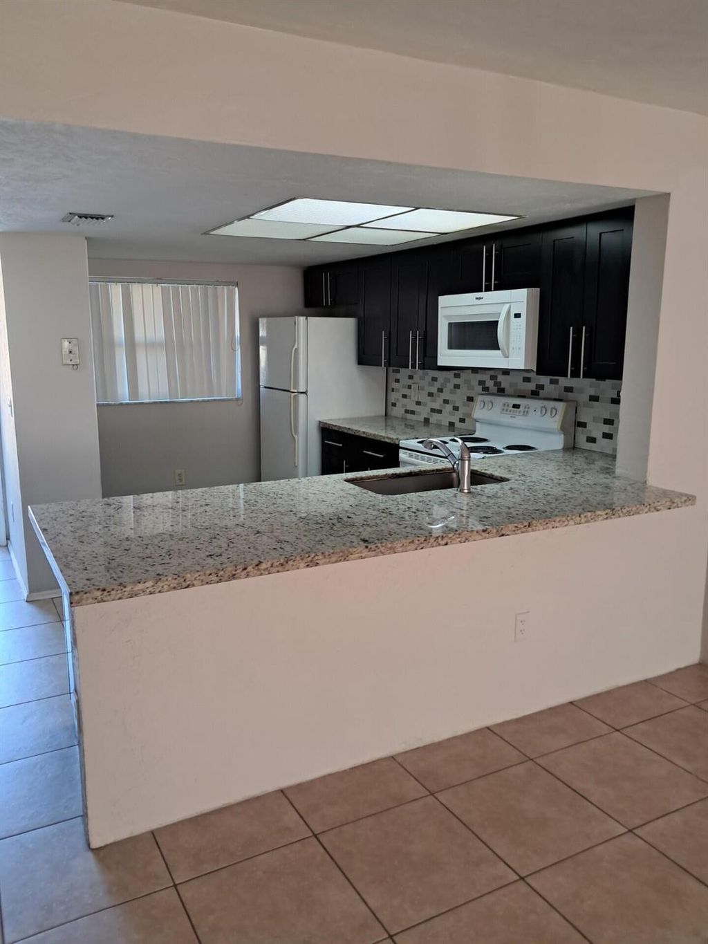 Photo of 104 Palm Beach Trace Drive, Royal Palm Beach, FL 33411 (MLS # R11149789)