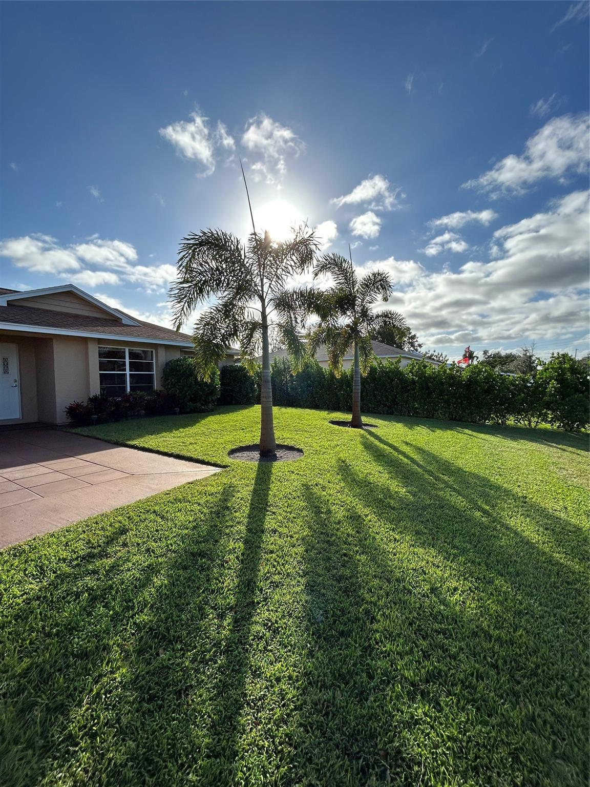Your new home awaits you! Make this Spacious 1837 SQ FT split plan 3 bedroom/2bathroom, with large 2 car garage your sanctuary. The Property boast primary bedroom with an ensuite, that leads out to a relaxing Lanai. You have high ceilings, an enclosed patio, and laminate wood floors. Beautiful kitchen with a breakfast nook. Tired after a hard day's work? Enjoy the relaxing atmosphere on your enclosed patio surrounded by a beautiful green landscape of luscious trees, shrubbery, and high hedges, providing an oasis for relaxation and entertainment. The luscious landscape provides a natural noise barrier. The property is located in east Port Saint Lucie, close to the beaches and coastal waterways.
