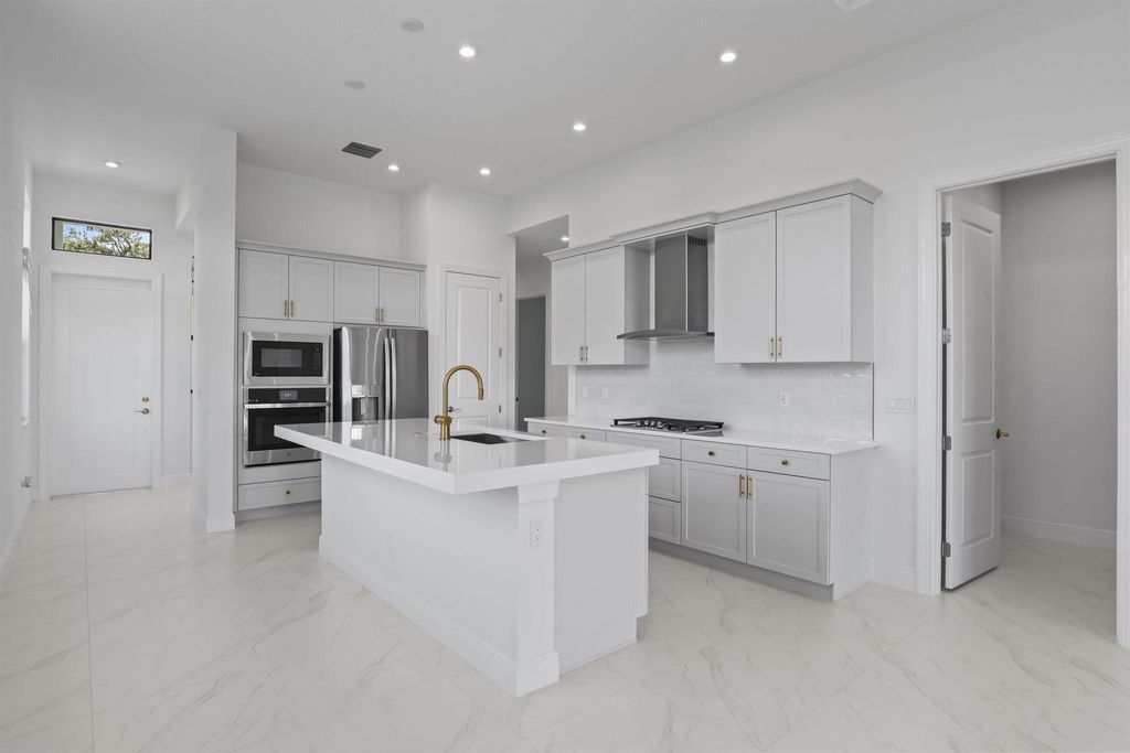 Photo of 415 SE Via Sangro, Port Saint Lucie, FL 34952 (MLS # R11114601)