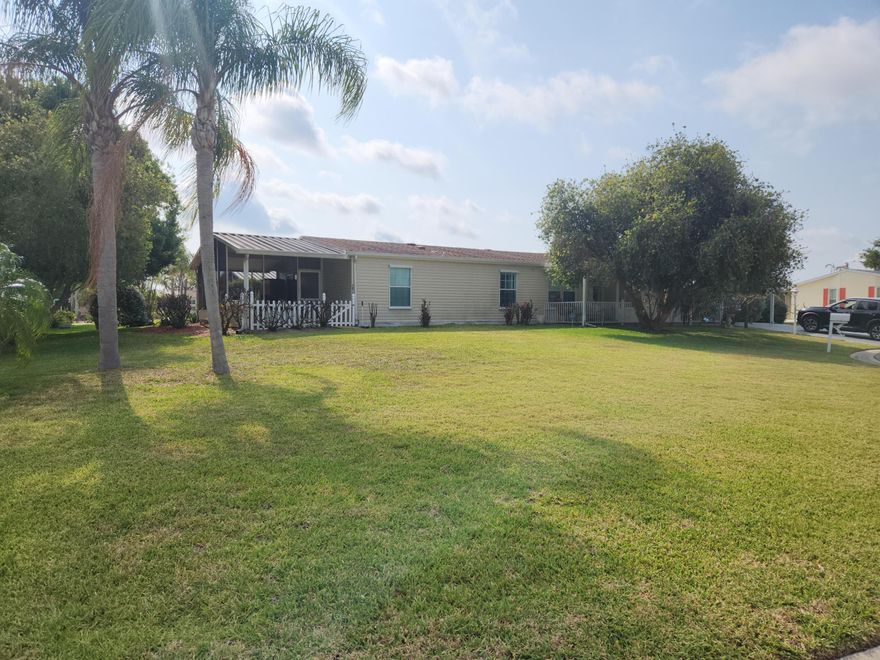 Spacious home on treed, corner lot in one of Port St. Lucie's most active 55+ communities. Beautifully updated kitchen with granite countertops, island seating and glass front cabinets. Enjoy sitting on the screened porch with a water view through the trees that offer plenty of shade. An adjacent covered patio is the perfect place for the barbeque. Or enjoy sitting on the covered front porch that faces the cul-de-sac with more trees! Back inside, kick back with family and friends in the formal living room or in family room that's off the kitchen. There is a dining area off the kitchen or pull out a barstool at the island in the kitchen for more casual dining. Split plan bedrooms. Like golf, theater, swimming, tennis, games and clubs? You won't run out of things to do in this community!