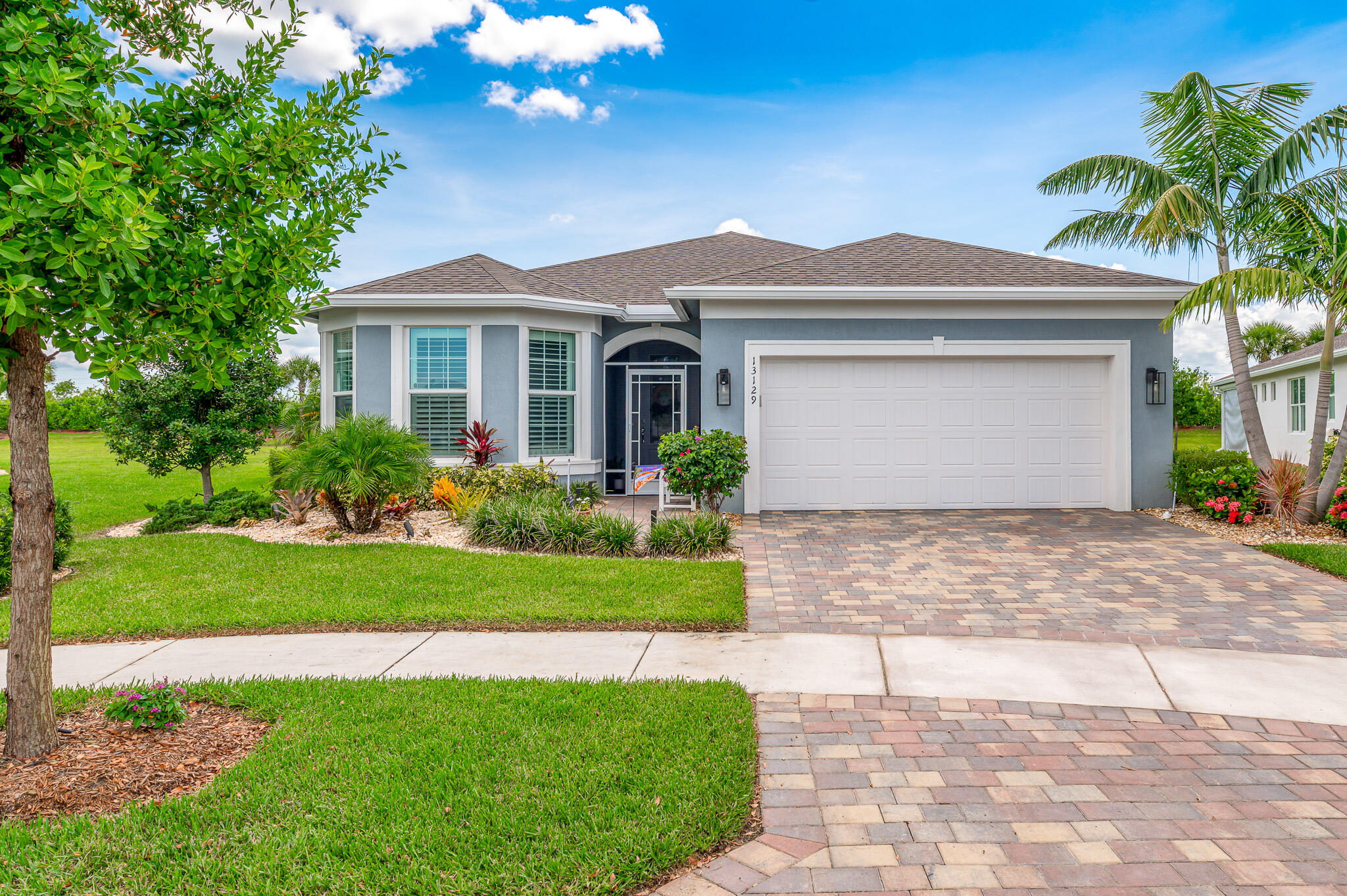 Live the good life in the premier 55+ community of Del Webb at Tradition! This 2022-built 3BR + den/office, 2BA, 2-car garage home is loaded with upgrades--impact windows, crown molding, plantation shutters, wood-look tile, and an airy open floor plan. The gourmet kitchen shines with quartz countertops, pantry, stainless steel appliances, wall oven, and gas cooktop. Retreat to the spacious primary suite with tray ceilings, walk-in closet, and spa-style en-suite. Step outside to your private backyard oasis with a screened patio, paver deck, hot tub, and room for a pool. All just minutes from shopping, dining, and major highways!