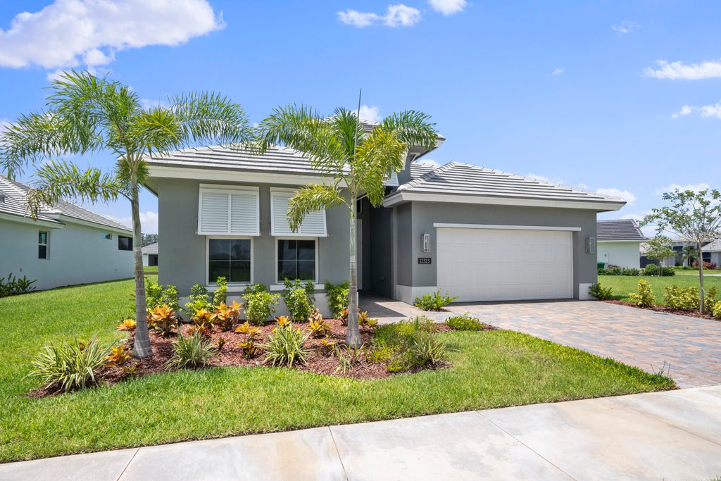 Photo of 12323 SW Sunset Lake Lane, Port Saint Lucie, FL 34987 (MLS # R10877218)