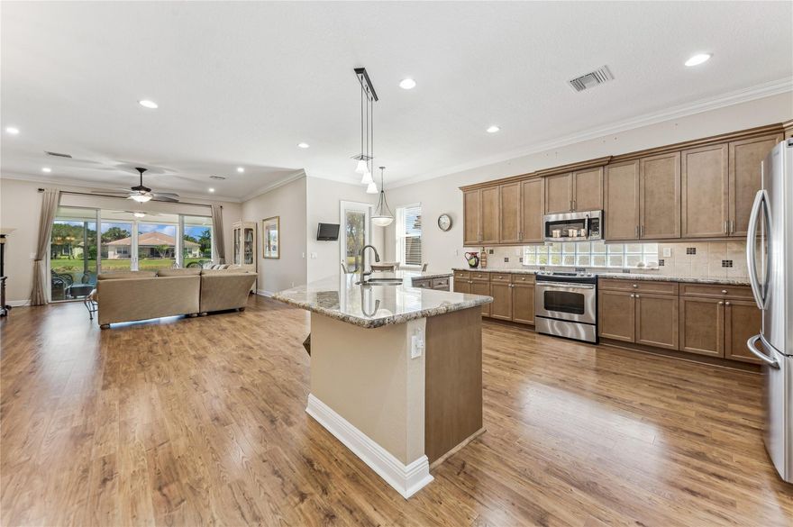 Indulge in picturesque sunsets from this exquisite lakefront property located in the Four Seasons. The 2012 DELRAY model, featuring 3 bedrooms and 2 bathrooms, offers a split floor plan for added privacy. Gourmet chef's kitchen with island awaits, complete with stainless steel appliances, granite countertops, and stylish wood cabinets and crown molding throughout this home, and a spacious Florida room with hurricane sliders. The primary suite boasts dual walk-in closets and an ensuite bathroom with dual vanities and a step-in shower. Included is a generator and hurricane protection. Minutes to Delray Beach Marketplace. Experience Florida living in this stunning property.  Active 55+ lifestyle awaits offering upscale amenities and activities.  Guard Gated community. Make an offer today!!! Savor breathtaking sunsets from the comfort of your private lakefront yard.