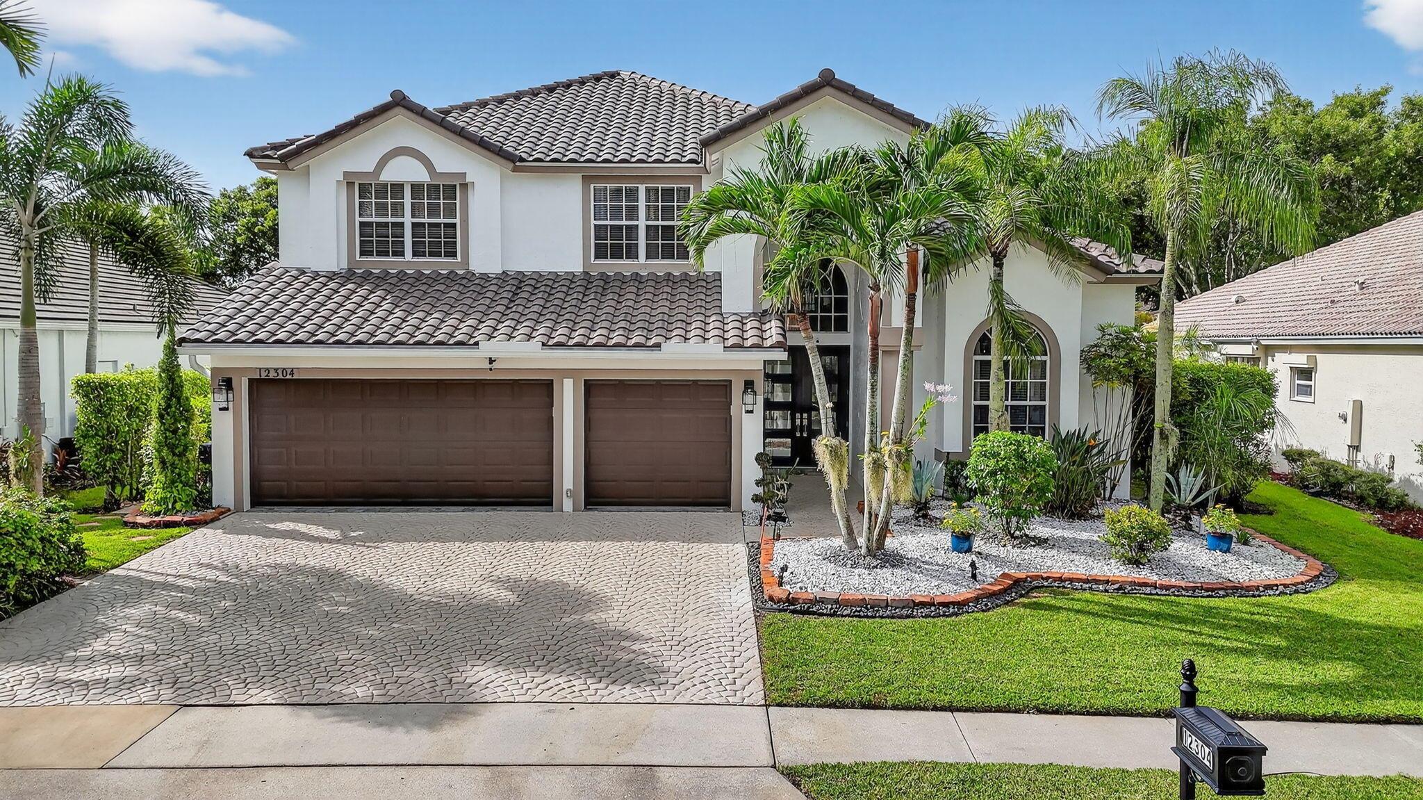 Welcome to your dream home! This spacious residence boasts over 3,000 sq. ft. of living space, offering 4 bedrooms, 3 bathrooms, and a 3-car garage with tile flooring and full air conditioning-perfect for extra storage, a home gym, or workshop. Step inside to find upgraded bathrooms, stylish finishes, and tile and wood flooring throughout. The heart of the home opens to a bright living space and a modern kitchen with stainless steal appliances, ideal for both entertaining and everyday living. Enjoy year-round relaxation in your private screened spa/pool, perfect for family fun or peaceful evenings. Recents updates include a new roof and new hurricane-rated front doors, giving you both style and a peace of mind. Located in a family-friendly neighborhood with A-rated schools.