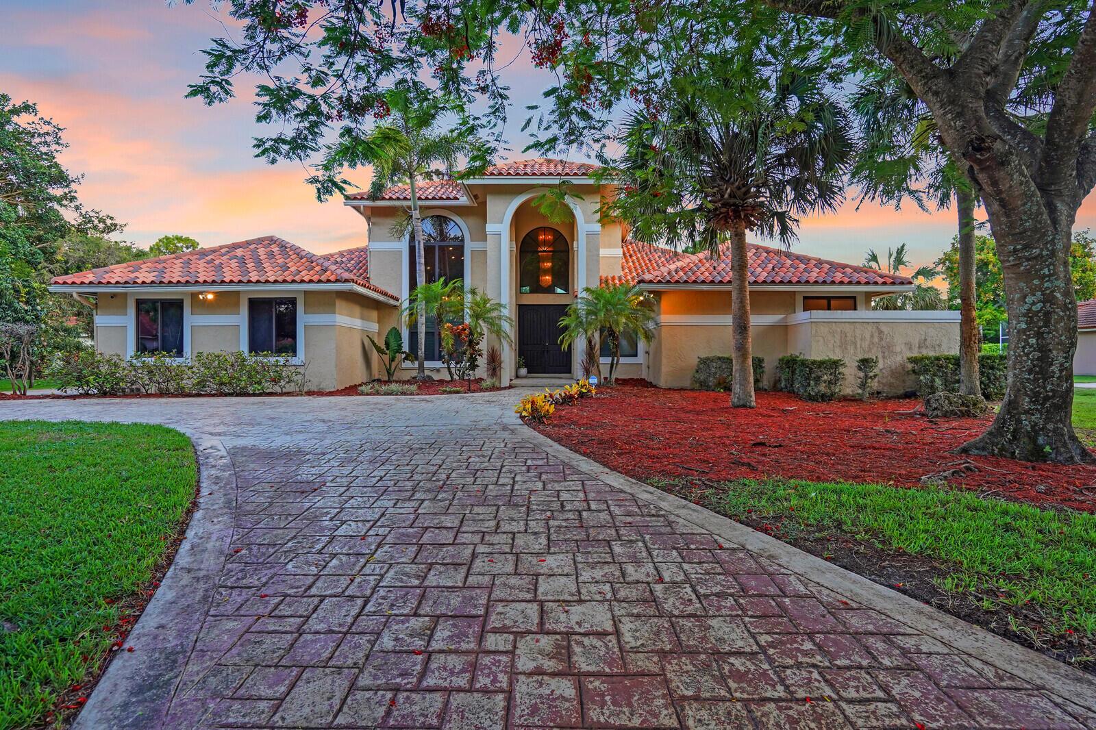 Welcome to this estate residence in the highly desirable neighborhood of Cypress Trail. This expansive home offers five spacious bedrooms and four well-appointed bathrooms, providing ample space for relaxation and privacy.As you step through the oversized front doors, you'll be greeted by an inviting atmosphere that seamlessly blends style with functionality. The heart of the home is perfect for both intimate family gatherings and entertaining guests, featuring an open layout that flows beautifully from room to room.The kitchen, located at the heart of the home, is perfect for family dinners and entertaining. Each of the five bedrooms offers a serene retreat, with the master suite serving as a luxurious sanctuary with an ensuite bath. The home is complete with impact windows a
