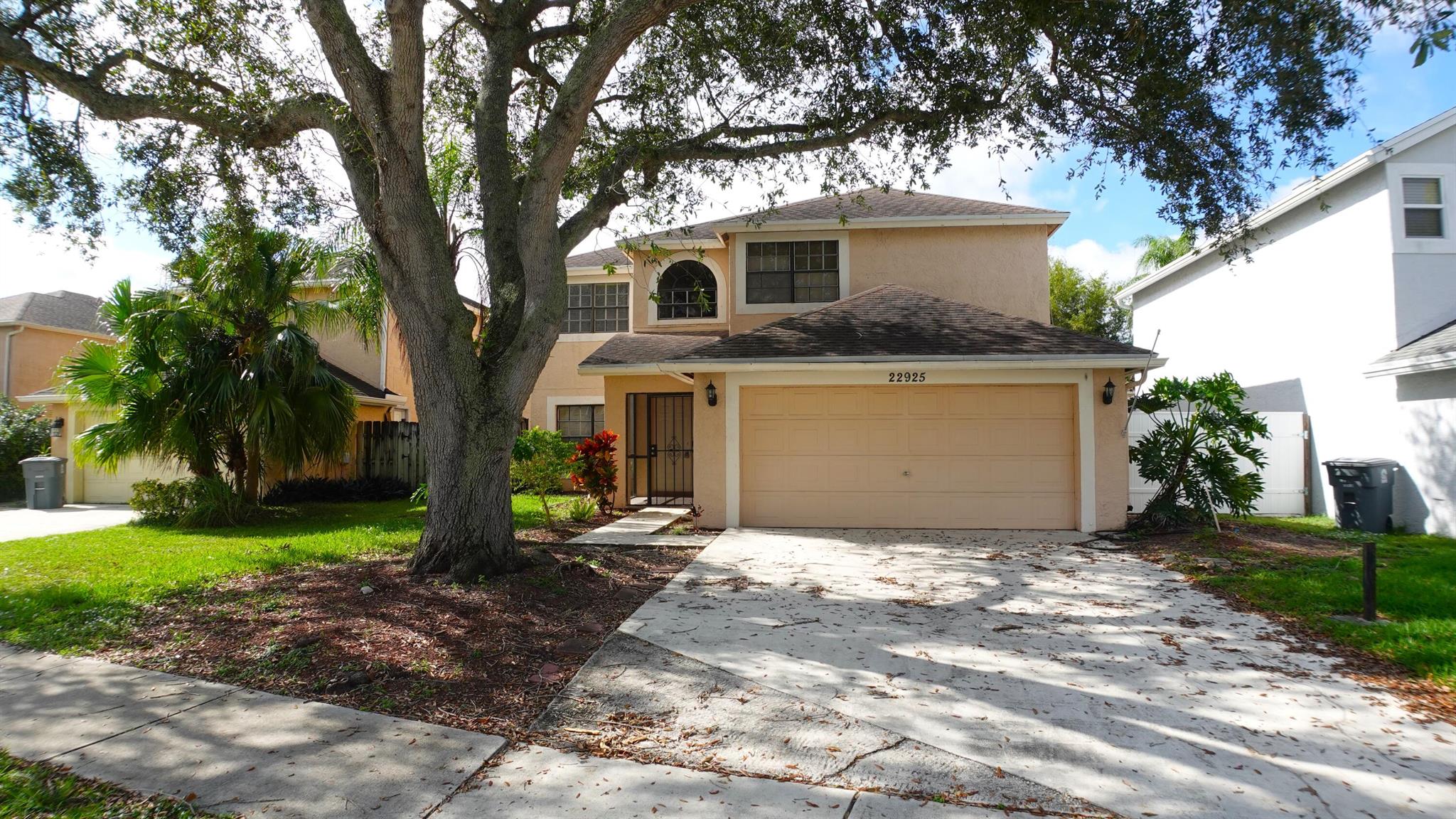 Welcome to this newly-renovated home for rent in Trends at Boca Raton, a friendly community with A-rated schools, community pool and tennis court! BRAND NEW KITCHEN - cabinets, counters & appliances - plus all new flooring, baseboards, blinds and light fixtures on the first floor. Plenty of living space with open kitchen/dining area, plus large living room, laundry room and half bath downstairs. All 4 bedrooms are upstairs. Primary suite has en-suite bathroom with separate tub and shower, plus a BIG walk-in closet. All bathrooms have new vanities, and new tile shower surrounds. 2-car garage, large driveway, covered/screened patio and huge, fenced back yard. Water/trash and lawncare included, tenant pays electric and cable/internet. No pets.