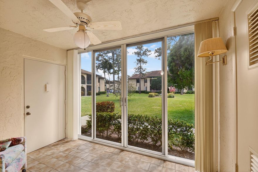 Welcome to this charming 2-bedroom, 2-bath condo offering 924 sq. ft. of comfortable, low-maintenance living in the heart of Greenacres. Perfectly situated on the desirable ground floor, this residence provides effortless accessibility and a peaceful setting with views of the beautifully maintained courtyard.  Always kept extremely clean!  Laminate floors in main area  with carpet in the bedrooms.   Looking for an owner to come in and make it their own.  An enclosed sunroom, walk-in closets in both bedrooms, and an in-unit full-size washer and dryer to add great value. While the kitchen, bathrooms, and carpeting are ready for updating, the home offers a solid foundation and a great layout, giving buyers the chance to add their own personal touches within this well-kept 55+ community. Pine Ridge is a friendly, well-maintained community where residents enjoy relaxed lifestyle and a variety of amenities, including a clubhouse, community room, sparkling pool, and shuffleboard.  Whether you're looking for a quiet place to unwind or a welcoming neighborhood with activities to enjoy, Pine Ridge offers a comfortable and convenient setting to call home.