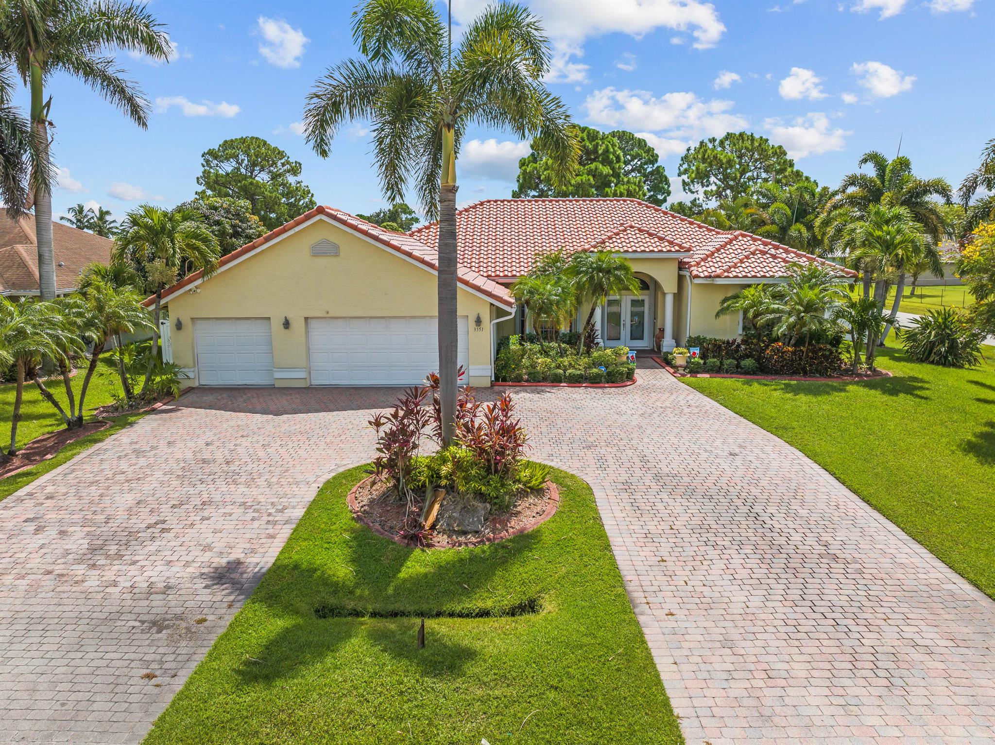 This move-in ready 3 bedroom, 3 bathroom home offers the perfect blend of comfort, functionality, and Florida lifestyle. Enjoy the open floor plan with new flooring throughout and a chef-inspired all-electric kitchen featuring a new fridge and range (2023), double oven, microwave/air fryer, industrial oven, and a large bar for casual dining or entertaining. The flexible layout includes two master suites, a split-bedroom plan for privacy, and a dedicated office space. French doors lead to a private backyard retreat with a screened pool and spa, outdoor kitchen, and dining area. The built-in BBQ and whole-house generator are powered by a propane tank. The fully fenced yard is perfect for pets or play. **An assumable VA mortgage with a 2.5% interest rate is available to eligible Veterans.**