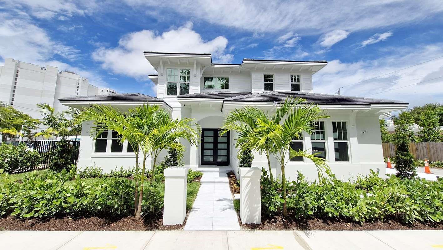 Experience the perfect blend of style, comfort, and convenience in this luxurious 4-bedroom, 4.5-bathroom coastal-modern residence, available for rent in the heart of West Palm Beach's historic Mango Promenade neighborhood. Designed for effortless Florida living, this fully furnished* home offers a seamless indoor-outdoor lifestyle with refined details and upscale amenities throughout.
Step into an inviting open-concept layout featuring soaring ceilings, designer lighting, and beautiful engineered wood flooring. The light-filled great room opens to a private backyard retreat through a wall of sliding glass doors, revealing a saltwater heated pool, spa jets, and lush tropical landscaping.