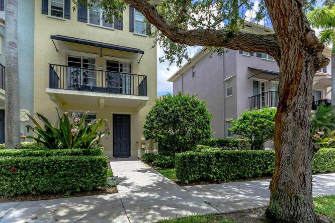 A beautiful 2 BR with den/office, 2 full baths & 2 half baths located in Greenwich community of Abacoa. This 1st floor corner home features a 1/2 bath & den/office that has the LIVE/WORK designation which allows for a commercial business on 1st level- The community has architect offices, accountants, computer services, etc. 2nd FL has a living room, kitchen, & a 1/2 bath, with the 3rd FL featuring 2 BRs with custom closets in bedrooms & pantry, including baths inside the rooms. The Greenwich community is within walking distance to shopping, restaurants & the Elementary school. The home has hard surface flooring throughout, new roof and painting -2022, new A/C-2019, new water heater-2019, new garage door opener-2023, new dishwasher and microwave-2023, hurricane panel shutters & central vac.