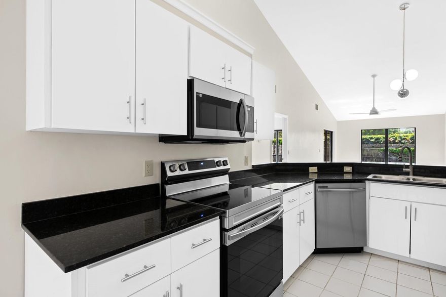 Freshly renovated villa in Wellington 3 bedroom 2 bath with garage and fenced yard! Entire unit just painted, both bathrooms new. All new appliances, new floors, and a screened porch in your own private peaceful backyard.  Bonus private courtyard in the front with extra long garage with lots of storage space and washer and dryer. Large living/dining room open floor plan with cathedral ceiling, sky lights. Lawn care and trash included. No HOA, Pets allowed with deposit, some breed restrictions. Walk to Tiger Shark park, schools and the Palm Beach Equestrian Center. A rated schools, New Horizon Elementary, Polo Park Middle and Wellington High School.