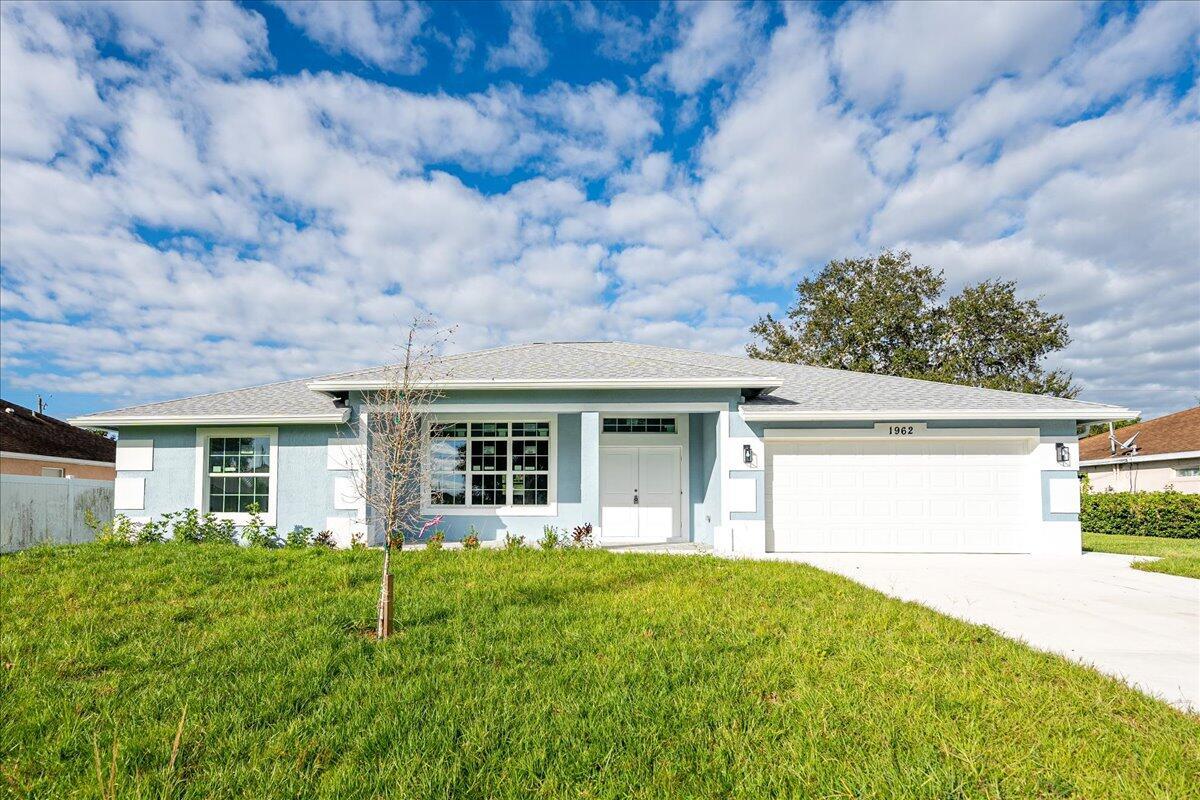 New construction house in desirable area of Port St Lucie. House boasts 4 bedrooms and 3.5 bathrooms. It has an outdoor shower and tons of room for a pool. .House has tons of upgrades. Ten foot ceilings in common area, open, modern floor plan, impact windows, waterfall style kitchen island, granite backsplash, upgraded granite in kitchen, bathrooms and window sills, porcelain tile throughout the house, bathroom tiled floor to ceiling. Soft close kitchen cabinets, seamless glass shower enclosures, modern lighting fixtures and LG kitchen appliance package. over $60,000 in upgrades already included in the house.