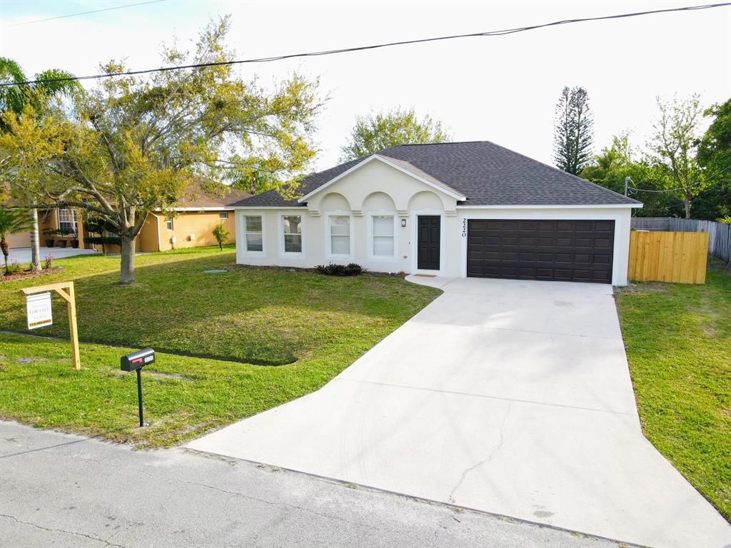 Photo of 2220 SE Trillo Street, Port Saint Lucie, FL 34952 (MLS # R10697633)