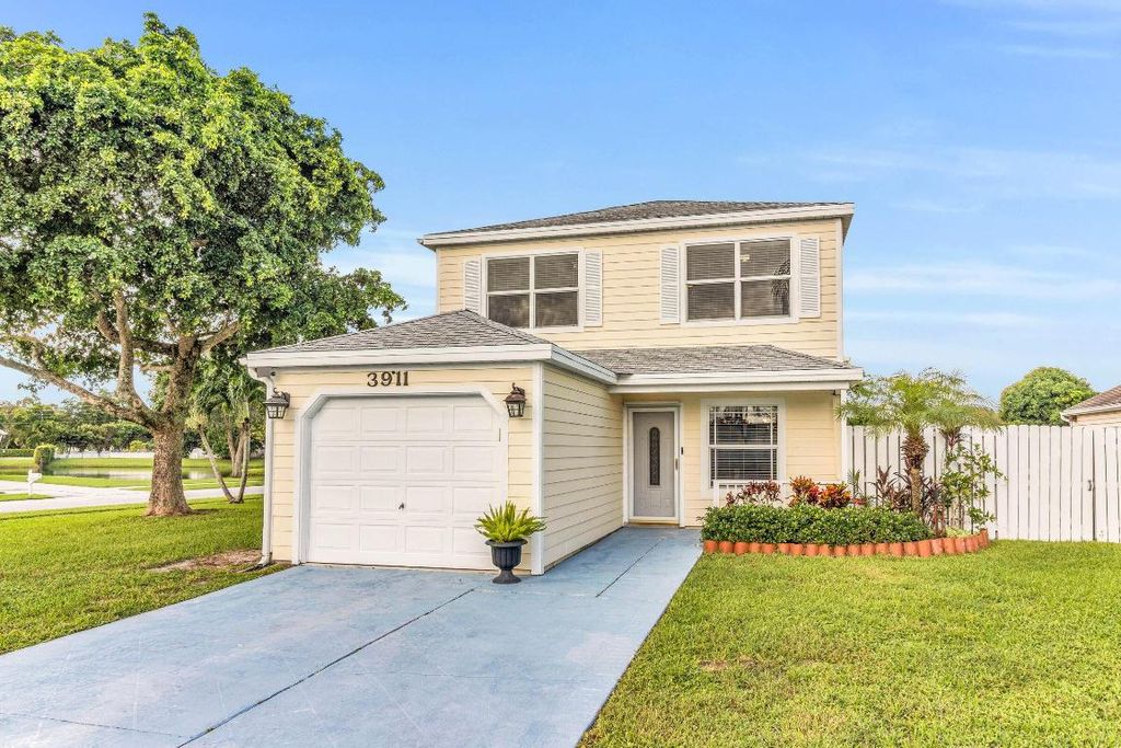 Photo of 3911 Circle Lake Dr, West Palm Beach, FL 33417 (MLS # R11143828)