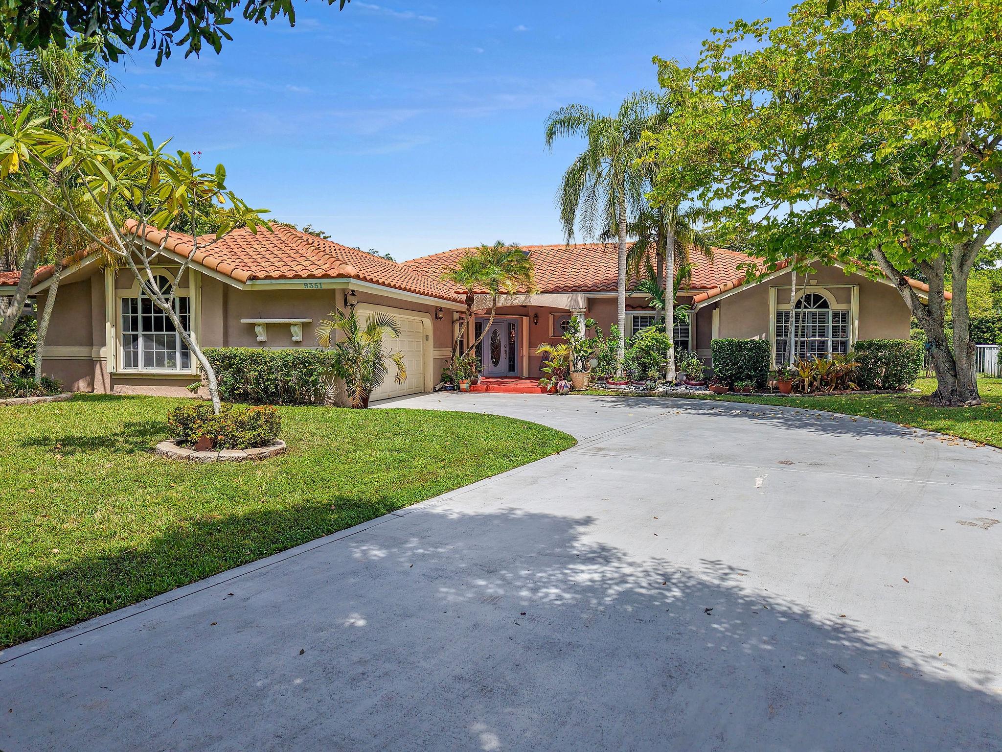 Welcome to gated Jacaranda Lakes the Enclave! This home is on an oversized lot of over 17k sqft! Oversized driveway allows plenty of parking for entertaining! Inside you'll find modern tile floors throughout the main living areas! Roof replaced 2019! Dual zoned ACs. Kitchen features granite counters, stainless steel appliances, 2 pantries, island, & opens to large family room! Primary bedroom is huge w 2 walk in closets & updated designer bathroom! 2nd full bath acts as cabana bath! Full accordion shutters for every opening! Garage door is hurricane rated! Private backyard retreat features large covered patio, pass through window from kitchen, beautiful pool (w child safety fence), fantastic green space, & fully fenced! Zoned for Central Park elem! Amazing location w nearby shops/dining!