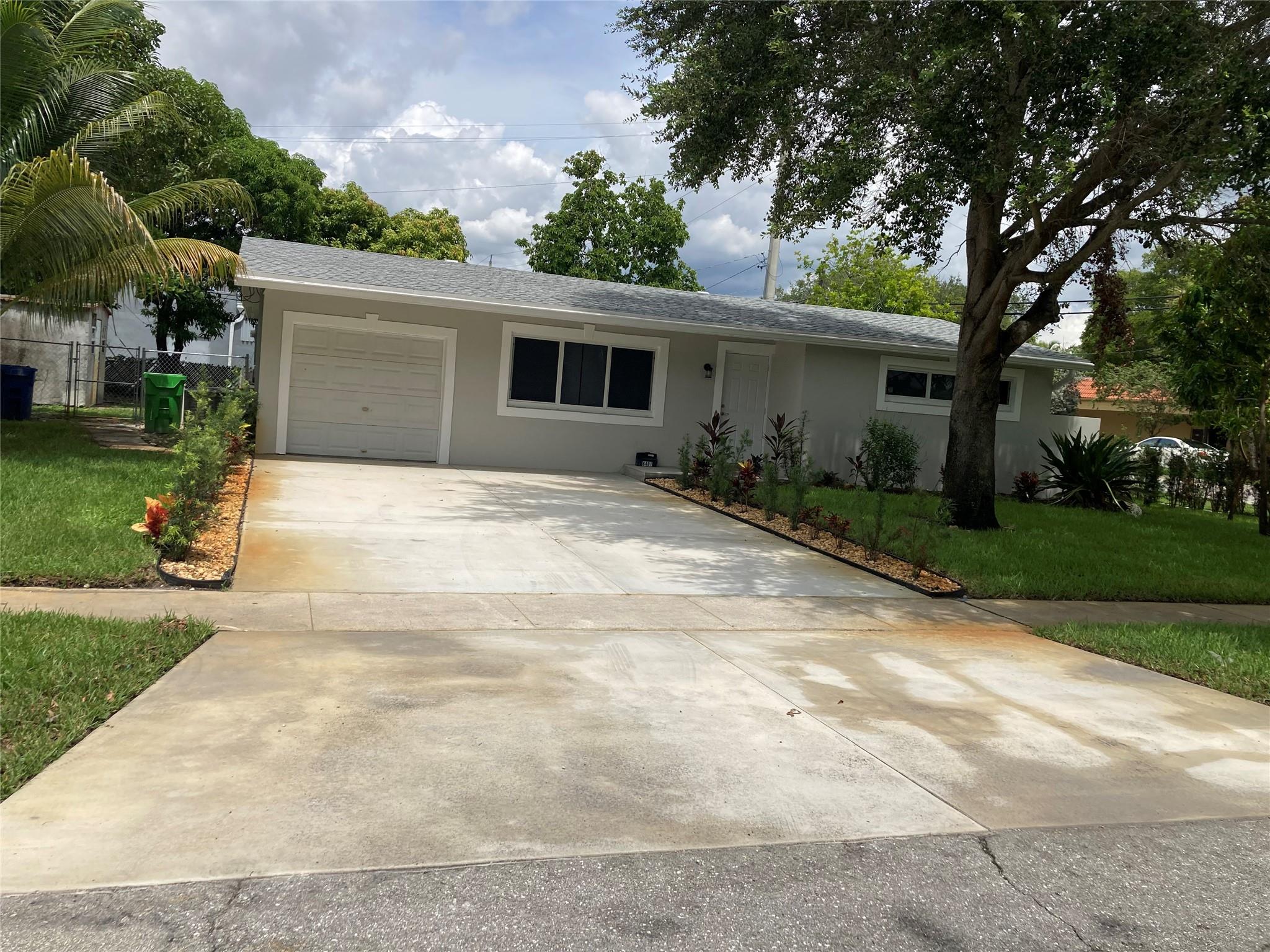 Beautiful and Spacious 4 Bedrooms 3 Baths and 1 car Garage recently remodeled and updated. This updated and upgraded home features new Kitchen Cabinets, New Flooring, New vanities, new High impact windows. freshly paint, new oversize 4 car driveway and modern finishes. Enclosed backyard perfect for relaxing and entertaining with no HOA. A spacious and Move-in ready Home offering true Florida lifestyle living.