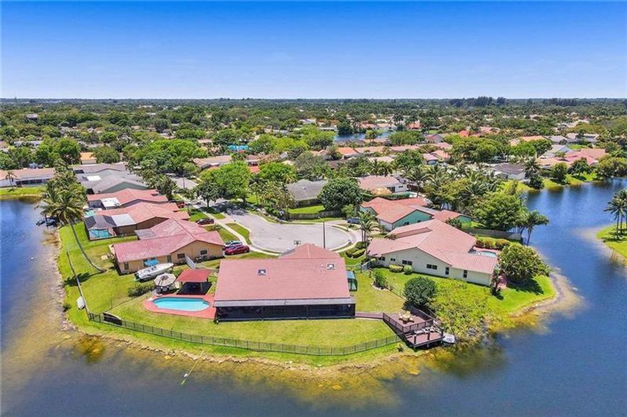 Beautiful Spacious Home With Incredible Lake View. Vaulted Ceilings! Over 13,000 SF Lot On Cul-de-sac Featuring Screened-In Porch Overlooking Serein Lake. Property Has 2 Decks: One On Water And Other Near Pool Area Ideal For Outdoor Entertaining.!! Marble Floors Throughout! Upgraded Eat-In Kitchen With Granite Countertops And Skylight For Natural Lighting. Formal Dining Room Overlooking Lake. Beautiful Stone Fireplace. Accordion Shutters . Huge Vaulted Ceilings Master Bedroom With Skylight, Walk in Closets. All Bedrooms Feature Plenty Of Closet Space. Walking Distance To House Of Worship!