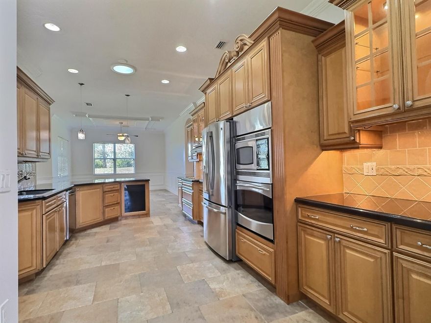 Reduced Price! This stunning 3-bedroom, 2-bath home in a desirable gated community offers a spacious layout, high ceilings, and elegant finishes. The kitchen features custom wood cabinetry, granite countertops, stainless steel appliances, and a breakfast nook. The primary suite boasts a walk-in closet and spa-like en-suite with a soaking tub and walk-in shower. Enjoy the private backyard and community amenities, including a clubhouse, heated pool, whirlpool, picnic area, and playground. With tile floors, a 2-car garage, and a prime location near shopping and dining, this home is a must-see! Schedule your tour today! Port Saint Lucie offers year-round sunshine, beautiful beaches, top-rated golf courses, and a relaxed lifestyle. Enjoy parks, outdoor activities, great affordable living