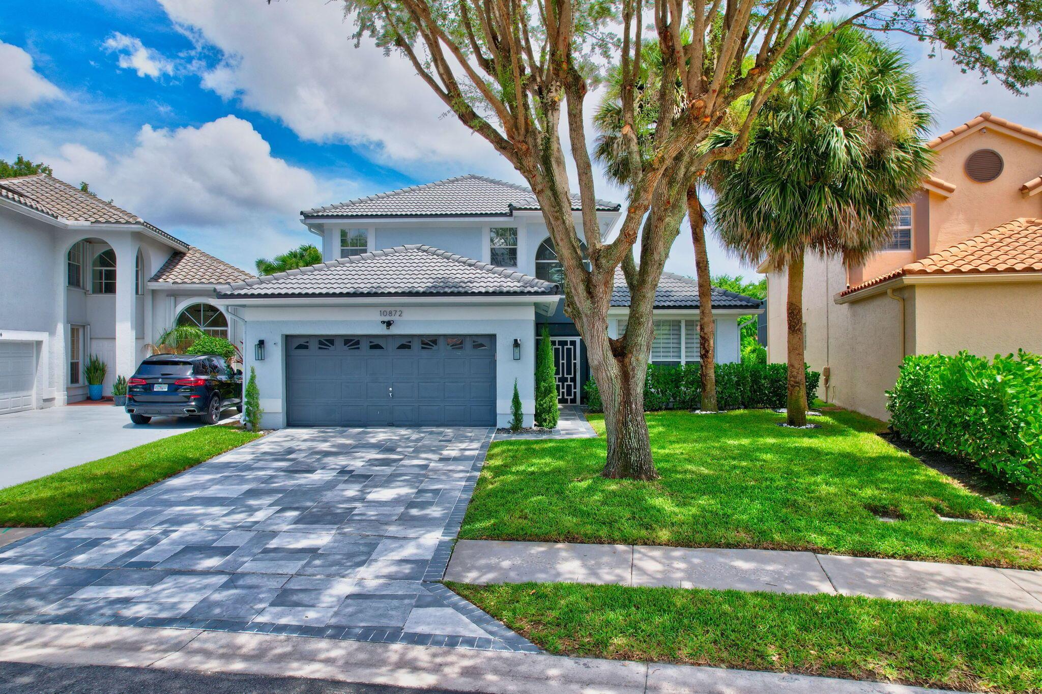 Make this fully remodeled waterfront pool home on a lake in Lakes at Boca Raton yours today. As you enter this light & bright home, you are greeted by a stunning two-story entry with breathtaking water and pool views. The home boasts a spacious living/dining room, newer appliances and an open family room with a large eat-in kitchen and pantry. Features include 48x24 porcelain tile on the lower level, an interior laundry room, and a first-floor master suite overlooking the pool and lake. Enjoy quality time with family and friends in the huge screened pool and spa. Located next to South County Regional Park and all A+ Rated schools. Awesome community amenities. community pool, fitness center, BBQ area, playground, pickleball, turf soccer field, tennis, basketball, and more.