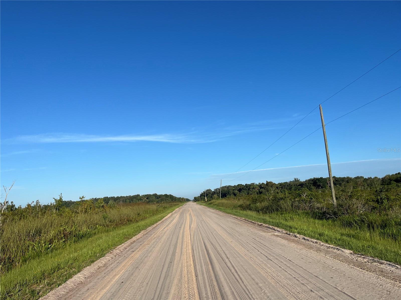 Own a piece of Florida's natural beauty with this spacious 2.5-acre parcel in the desirable Okeechobee Prairies. Zoned Residential Agriculture, this property offers flexibility to build your dream home, place a mobile home, or start a small hobby farm. Horses, livestock, and outdoor toys are welcome! Enjoy the freedom of country living with nearby electric making development easy. No HOA, no time to build -- just wide-open skies, quiet surroundings, and endless possibilities. Whether you're looking for a private retreat, homestead, or long-term investment, this land is ready for your vision.
