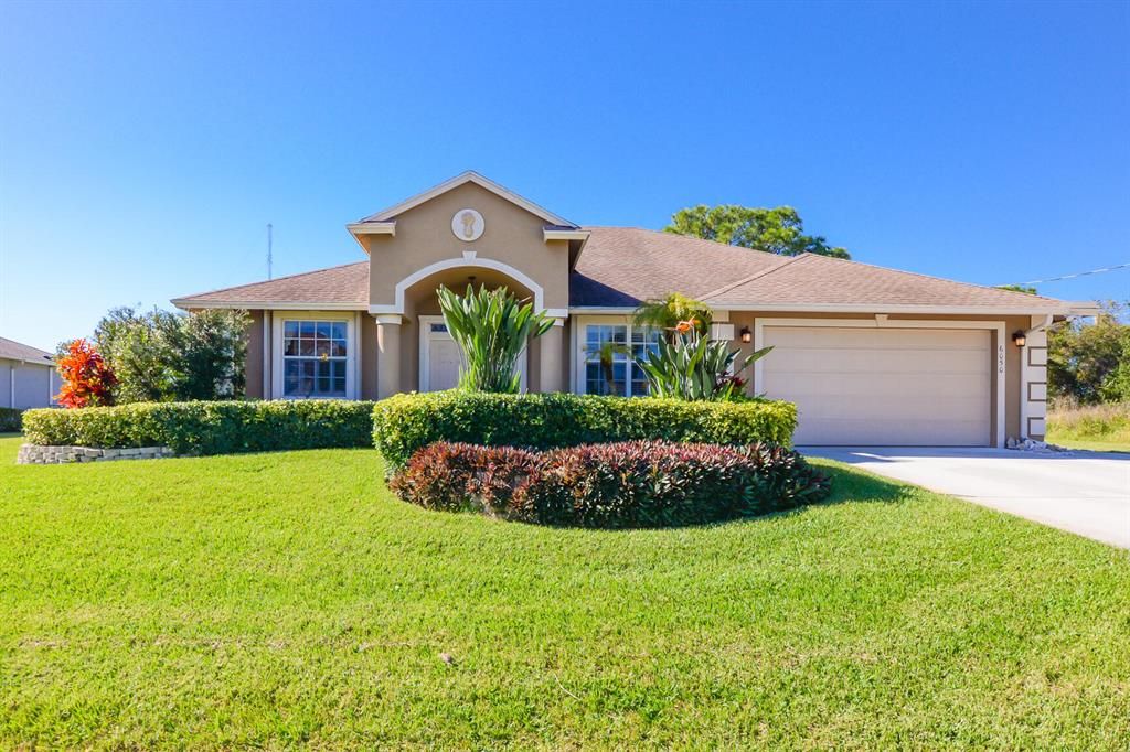 Photo of 6050 NW Wolverine Road, Port Saint Lucie, FL 34986 (MLS # R10761624)