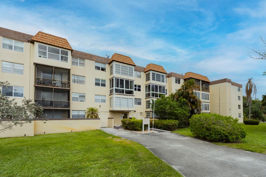 Beautifully renovated condo in the prestigious Omega community. Bright, open floor plan with fresh paint, LED recessed lighting, and custom fans throughout. Stylish eat-in kitchen with quartz countertops, tile backsplash, wood cabinetry, and stainless steel appliances. Spacious primary bedroom with two large closets and private en-suite. Enjoy a covered private balcony overlooking lush landscaping. Just a short walk to the pool, with access to a clubhouse, tennis courts, and laundry on the same floor. Assigned and guest parking included. Prime location near top-rated schools, parks, dining, shopping, and the Turnpike. A/C 2005. 50-year recertification complete.