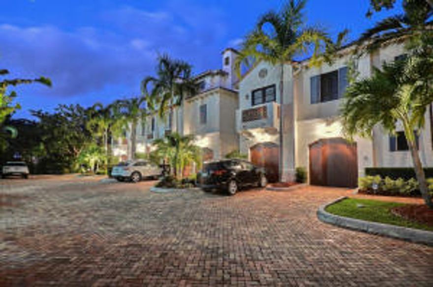 Rare opportunity to own this Old-World Mediterranean style Townhome which offers direct Intracoastal living. This is one of only four units in the Harbour House, making it quiet and secluded. The home boasts a Private Yard with Pool, Top tier gourmet Kitchen, Wet bar, Elevator, Two vehicle garage and Large Master Bedroom coupled with His and Hers bathrooms and Walk in closets. Located on a private street just a block North of Atlantic Avenue. A short stroll to fine boutiques, restaurants and the beach. When it comes to architectural design, location, and pure sophistication... this home takes the crown.