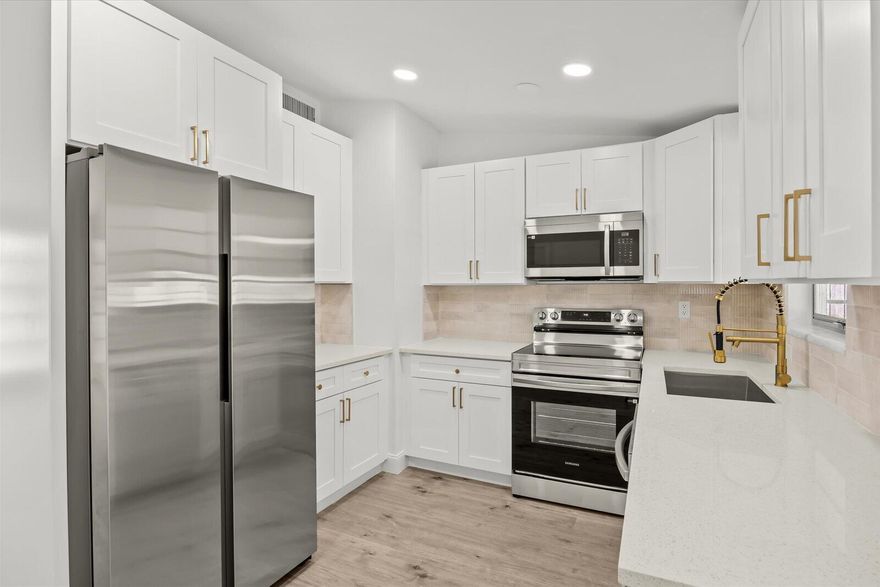 Showings must be scheduled with Showingtime. Exquisite 3-bedroom, 2-bathroom residence, fully renovated in 2025. The gourmet kitchen boasts luminous Calacatta quartz countertops, bespoke soft-close shaker cabinetry, and premium high-end finishes, designed to inspire culinary excellence. Luxurious spa-inspired bathrooms feature sophisticated tile work, free standing tub, gorgeous vanities, and contemporary fixtures, elevating daily rituals to a serene escape. Impeccable waterproof laminate flooring, freshly painted interiors and exteriors, and brand-new, top-tier appliances blend style with functionality. Enjoy effortless access to I-95, premier shopping, and dining, with the freedom of no HOA restrictions. This residence seamlessly blends modern luxury with timeless comfort.