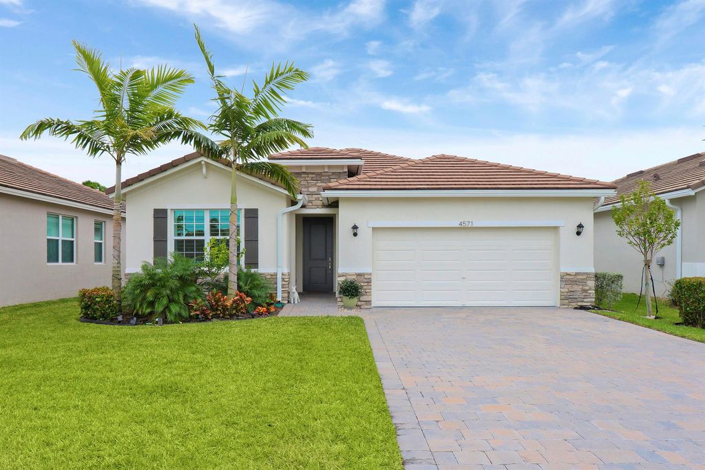 Photo of 4571 NW Exchange Avenue, Jensen Beach, FL 34957 (MLS # R10943326)