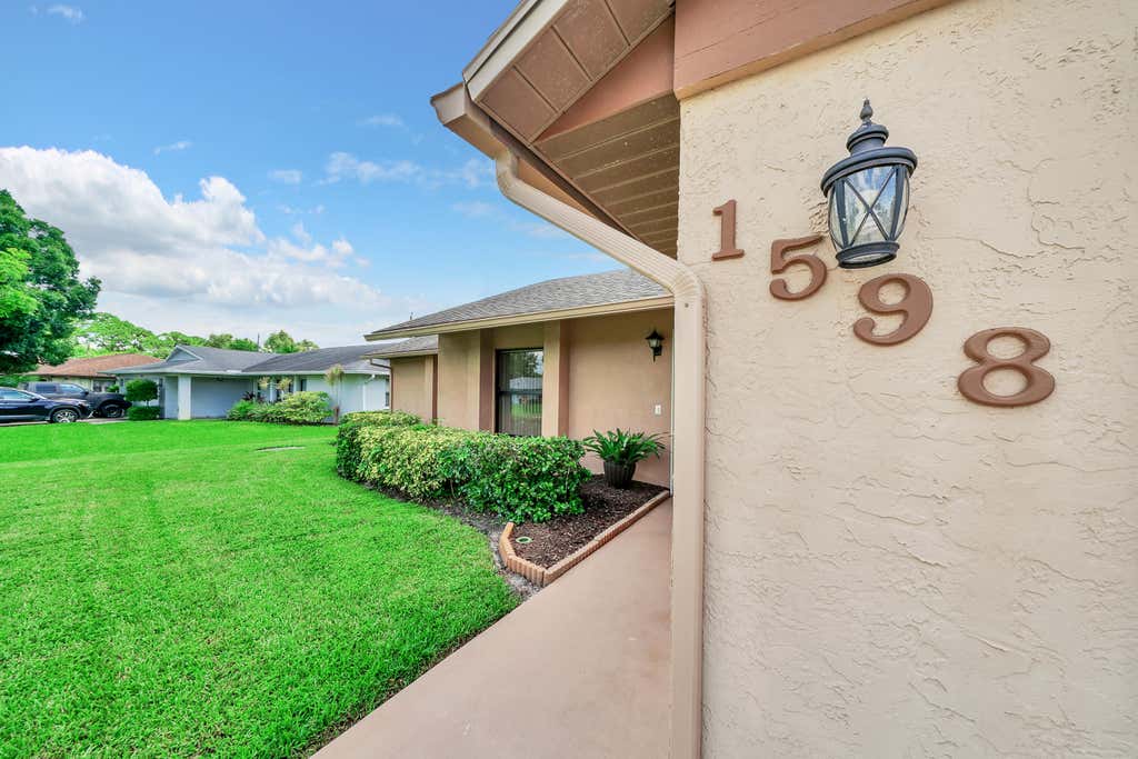 Photo of 1598 SE Holiday Road, Port Saint Lucie, FL 34952 (MLS # R11020123)