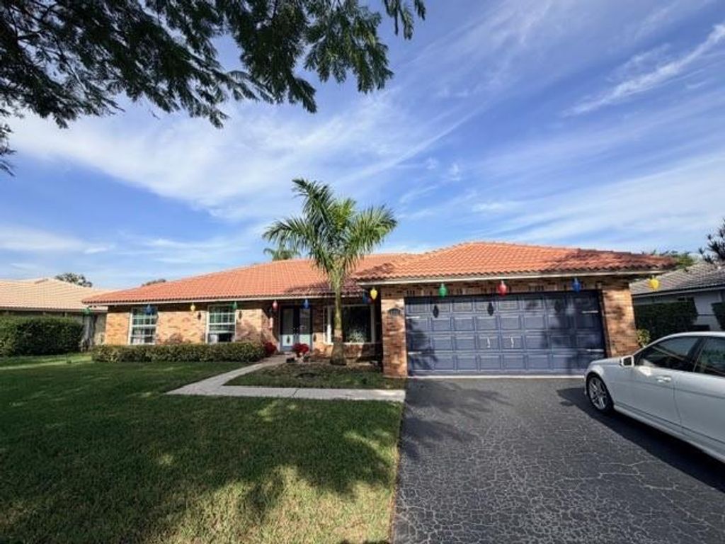 Photo of 10931 NW 4th St, Coral Springs, FL 33071 (MLS # F10540791)