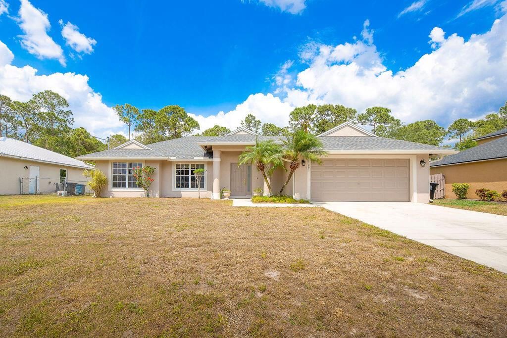 Photo of 1581 SW Delos Avenue, Port St Lucie, FL 34953 (MLS # R10879165)